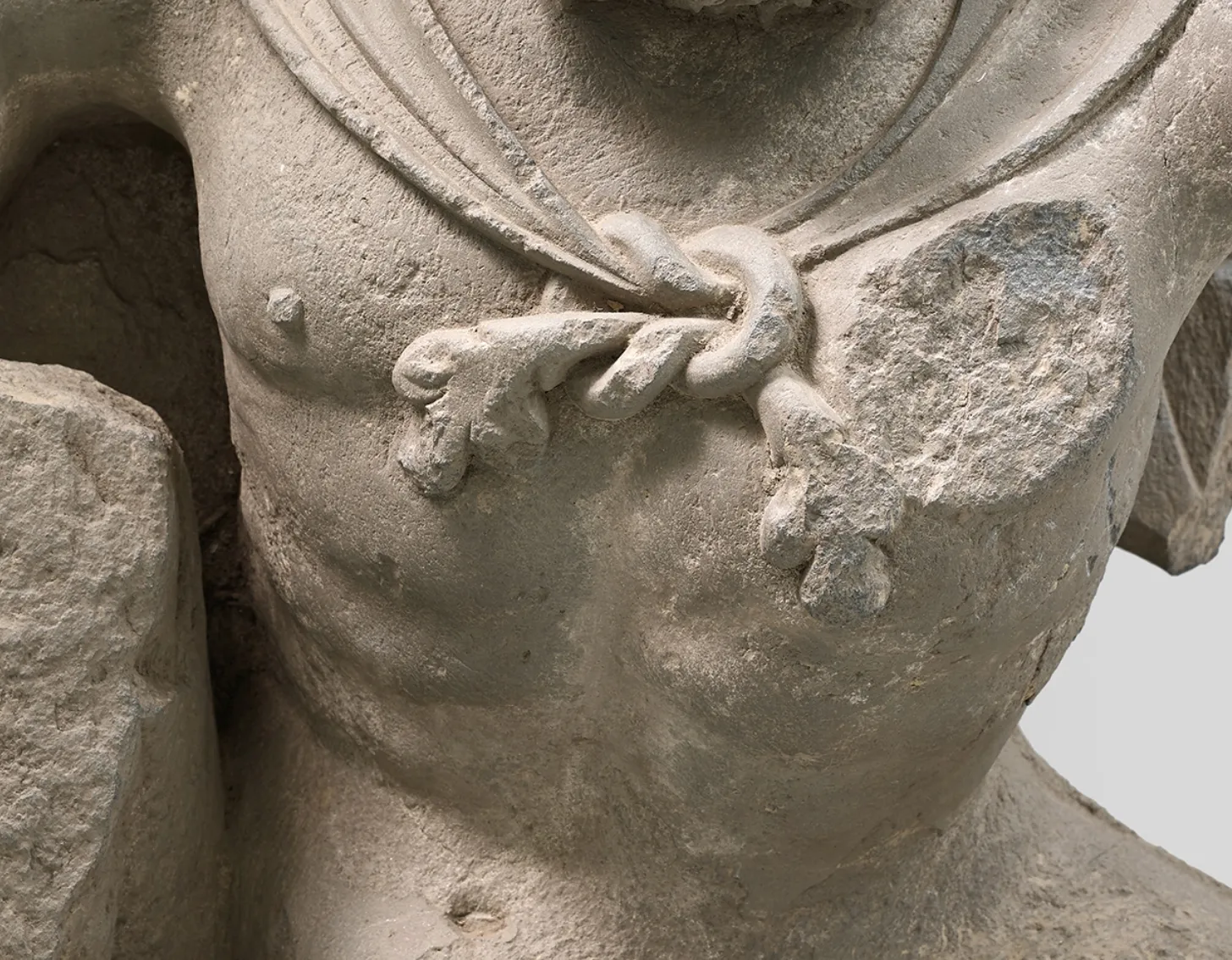 Close up look of : A grey schist figure of Atlas